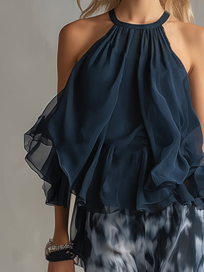 Luisa - elegante vestido de gasa con corpiño de cuello alto y pantalón ancho estampado.