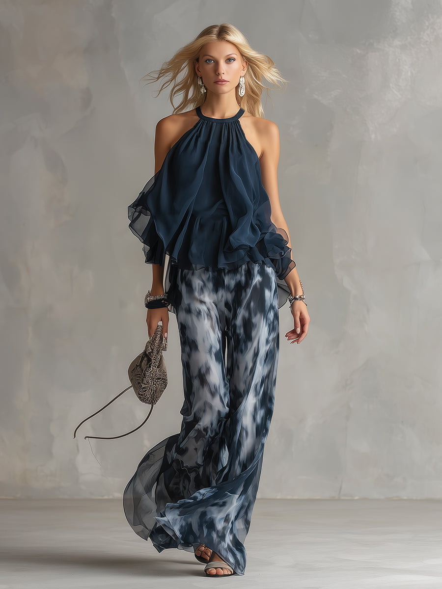 Luisa - elegante vestido de gasa con corpiño de cuello alto y pantalón ancho estampado.