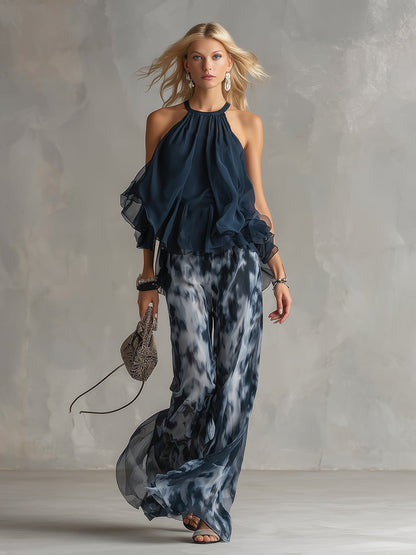 Luisa - elegante vestido de gasa con corpiño de cuello alto y pantalón ancho estampado.