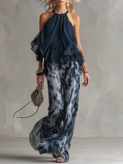 Luisa - elegante vestido de gasa con corpiño de cuello alto y pantalón ancho estampado.