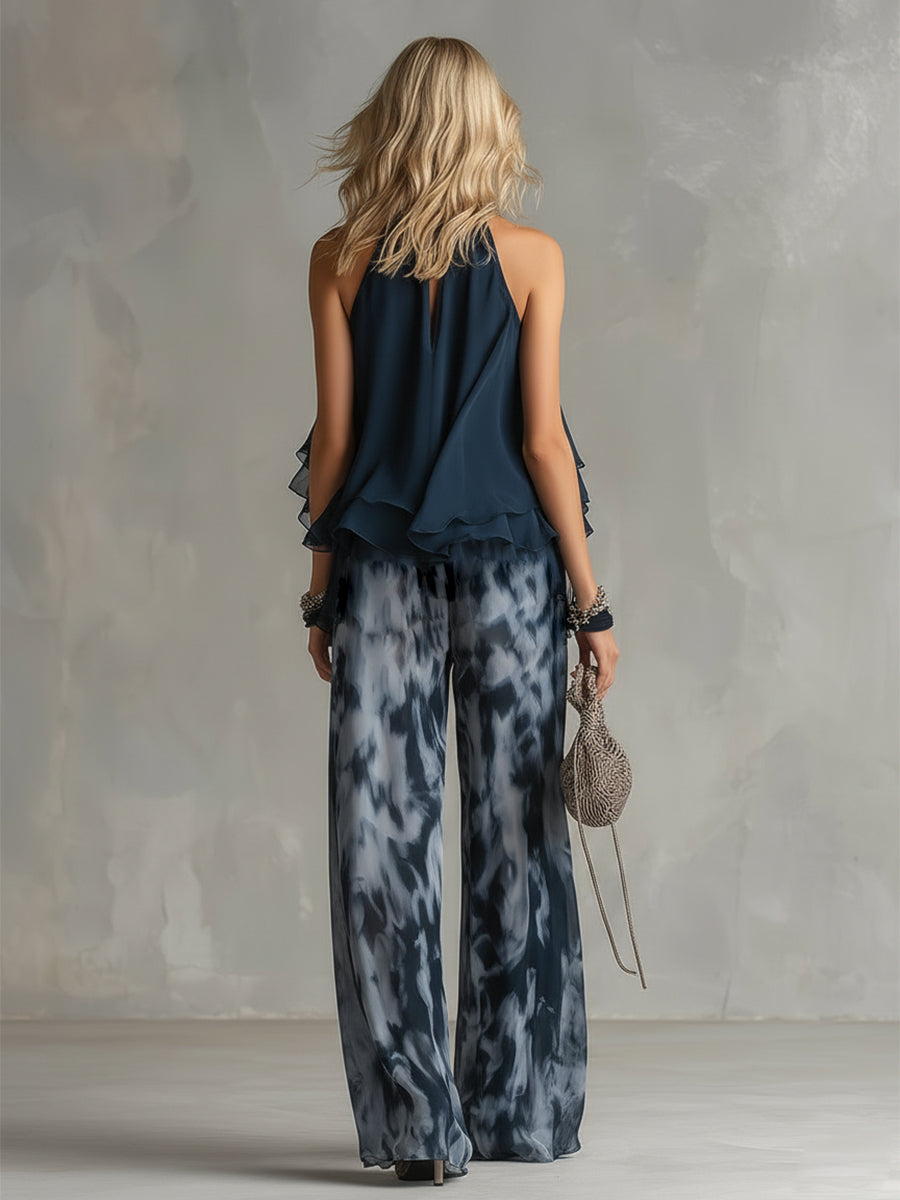 Luisa - elegante vestido de gasa con corpiño de cuello alto y pantalón ancho estampado.