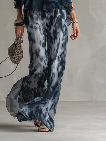 Luisa - elegante vestido de gasa con corpiño de cuello alto y pantalón ancho estampado.